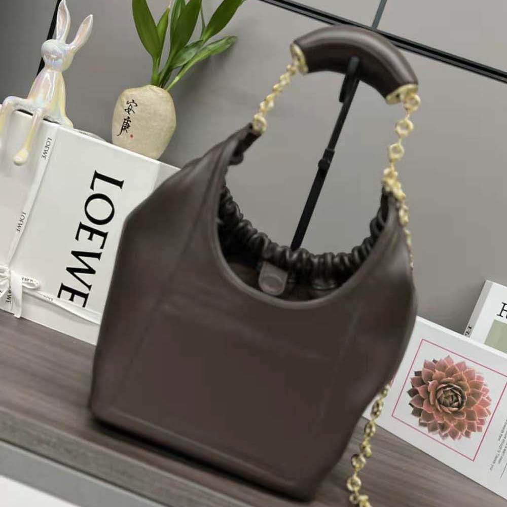 Side angle showing compact silhouette of Loewe Women Small Squeeze Bag