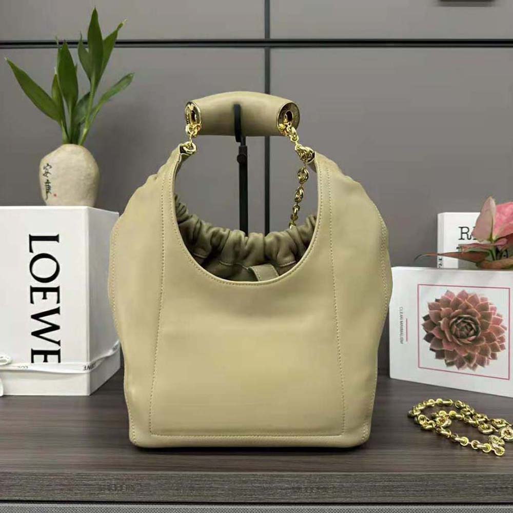 Side profile showing curved silhouette of Loewe Small Squeeze Bag
