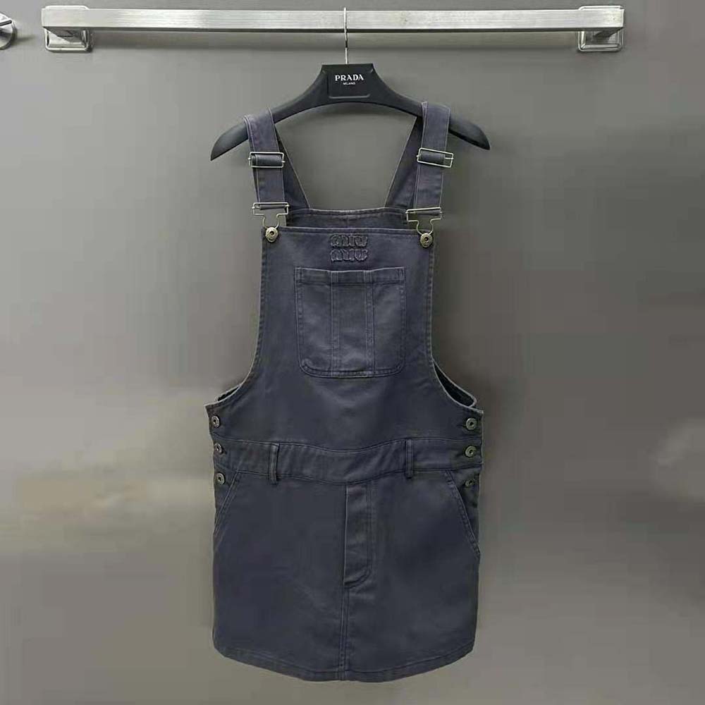Close-up of Miu Miu zip closure and hardware on overall mini-dress