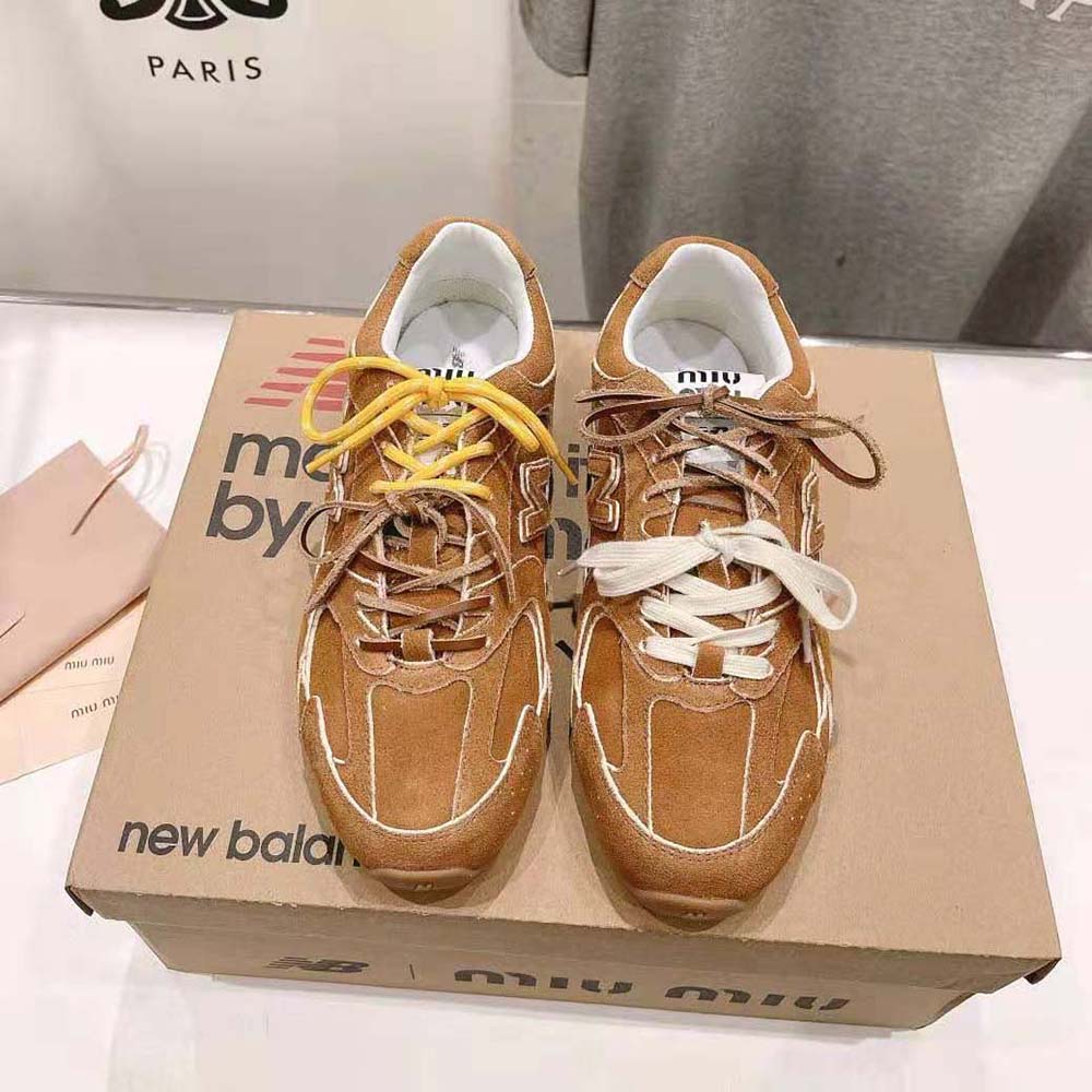 Close-up of brown suede texture and logo detail on Miu Miu sneakers