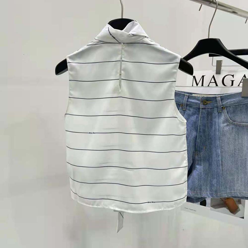 Side angle showing relaxed fit of Miu Miu Women Striped Sablé Top