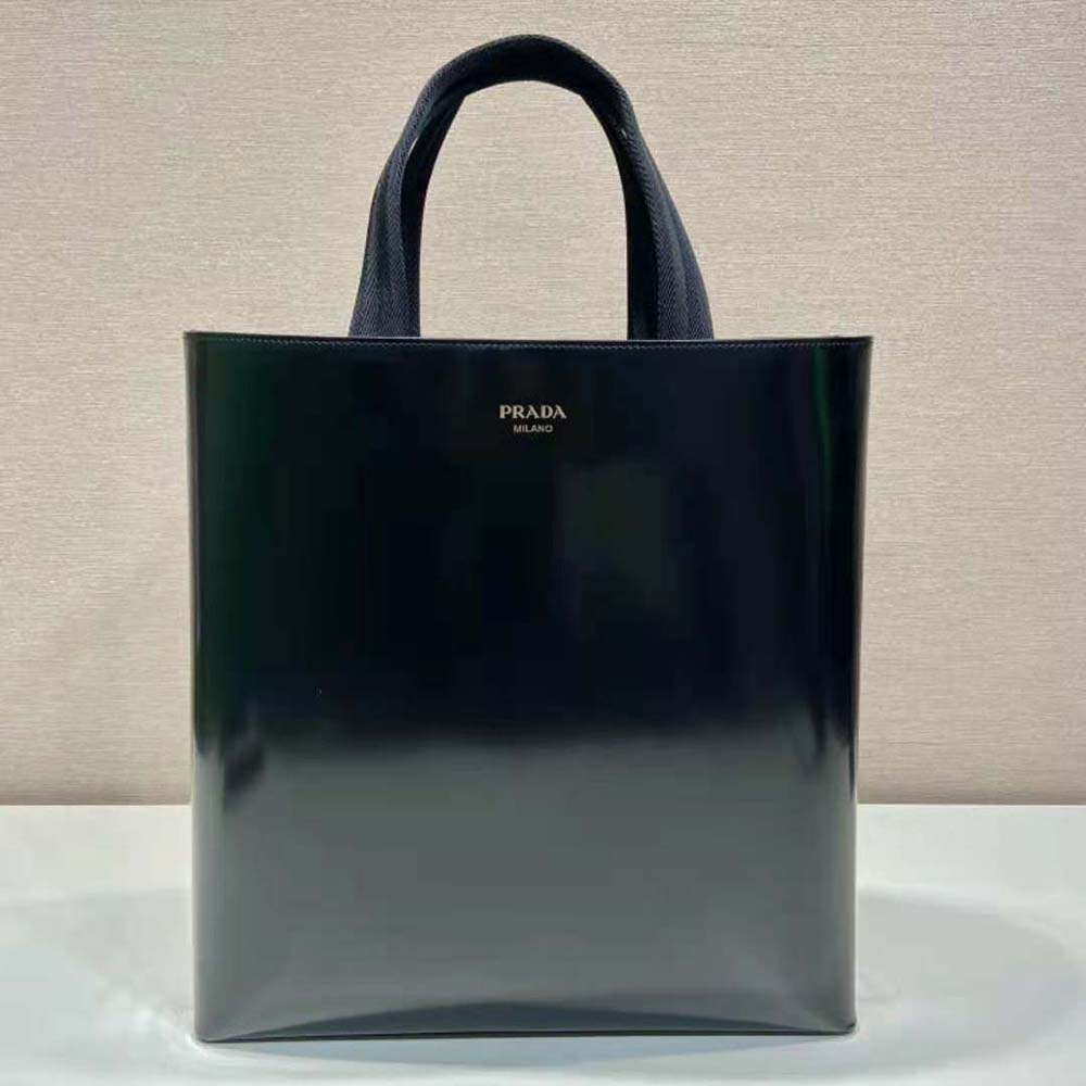 Close-up of brushed leather texture and silver Prada logo hardware