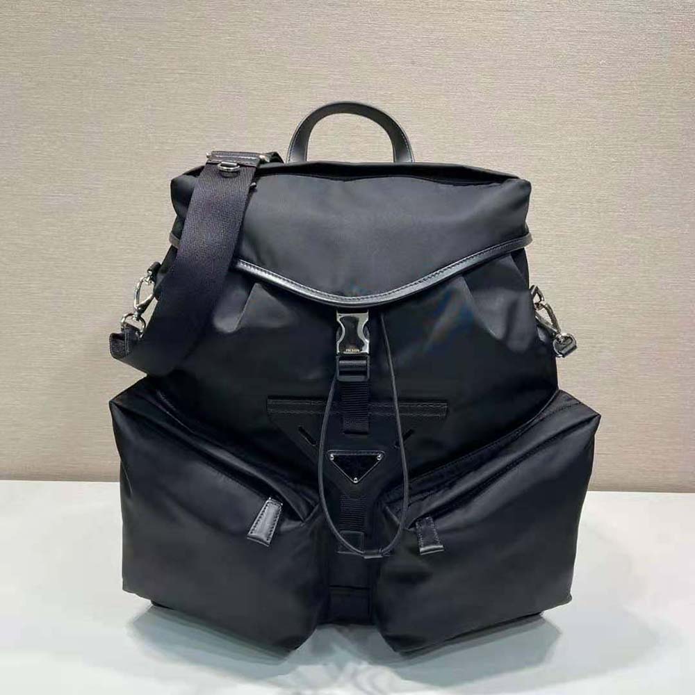 Close-up on silver hardware and leather trim of Prada backpack