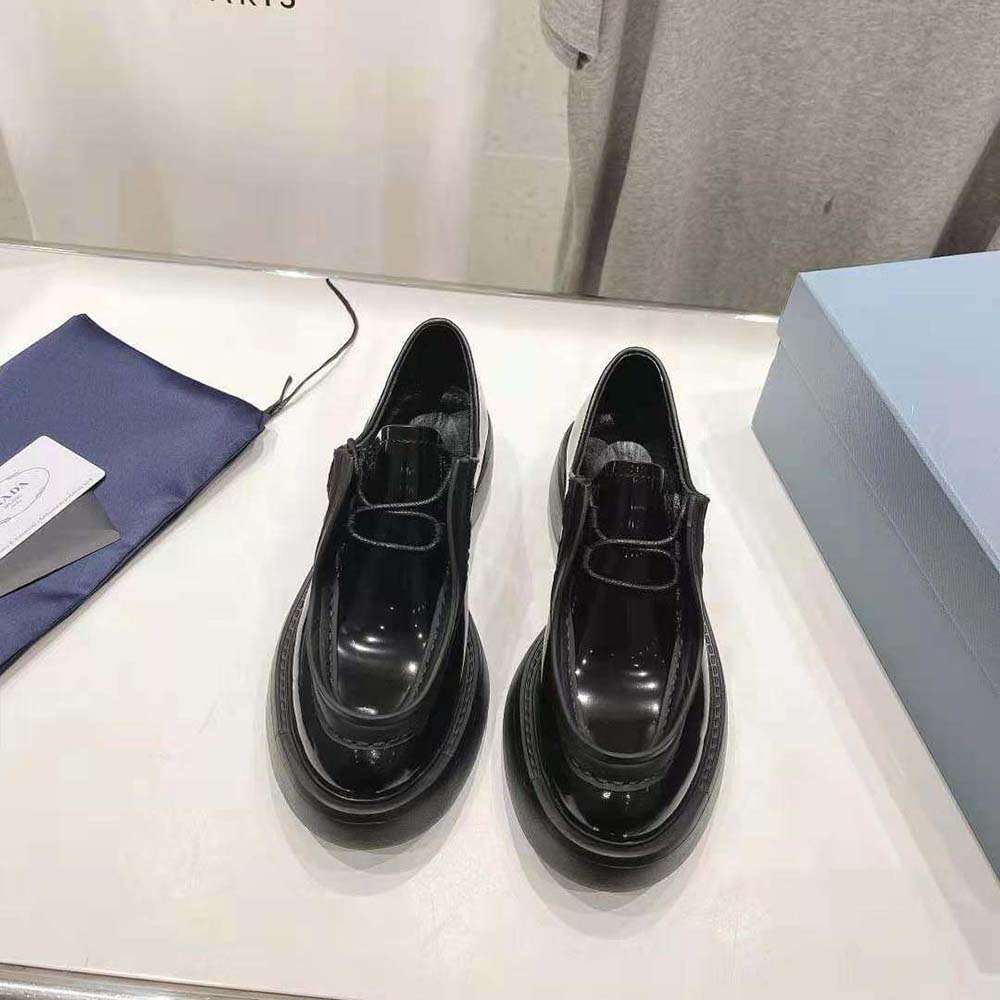 Close-up of black brushed leather texture on Prada Women Lace-up Shoes