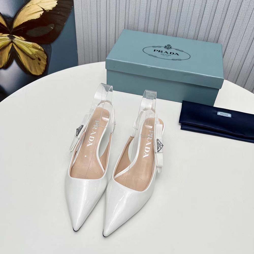 Close-up of glossy patent leather and slingback strap on Prada pumps