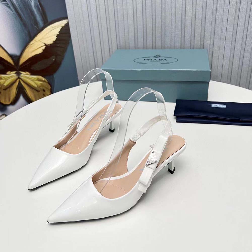 Rear angle highlighting Prada logo hardware on white slingback pumps