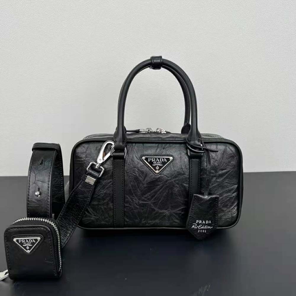Close-up of black antique nappa leather texture on Prada top handle bag