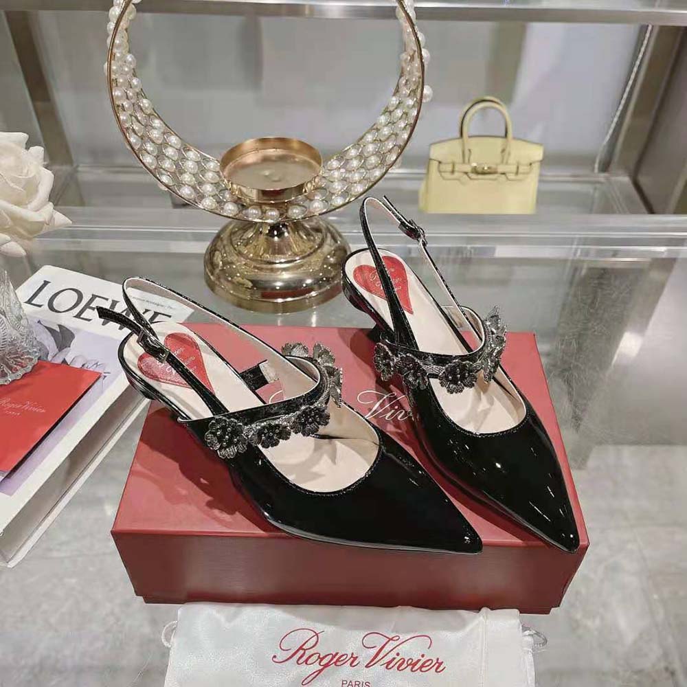 Back angle showing adjustable slingback strap on Roger Vivier patent leather pumps