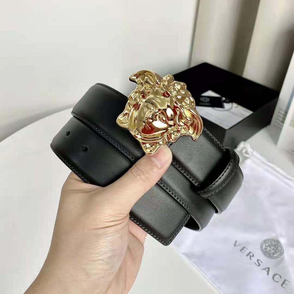 Side angle showing smooth black leather strap of Versace Unisex La Medusa Leather Belt-Black