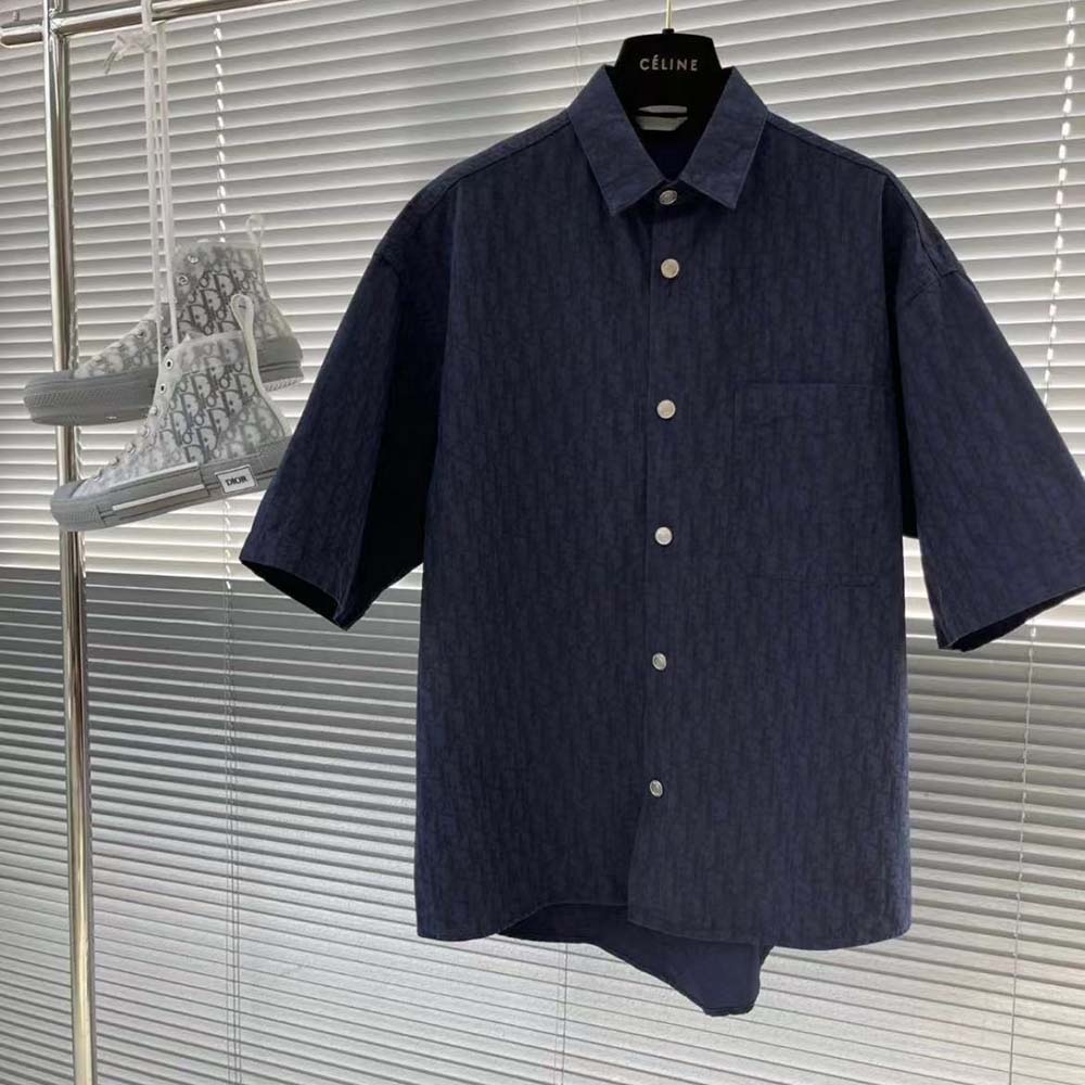 Close-up of silver Dior charm detail on Dior Men Dior Charm Short-Sleeved Shirt