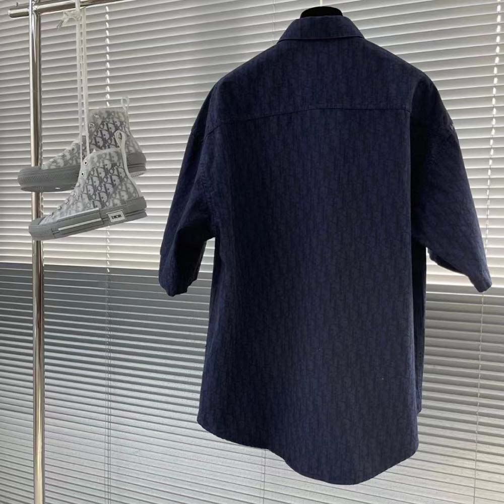 Side angle showing navy fabric and short sleeves of Dior Men Dior Charm Short-Sleeved Shirt