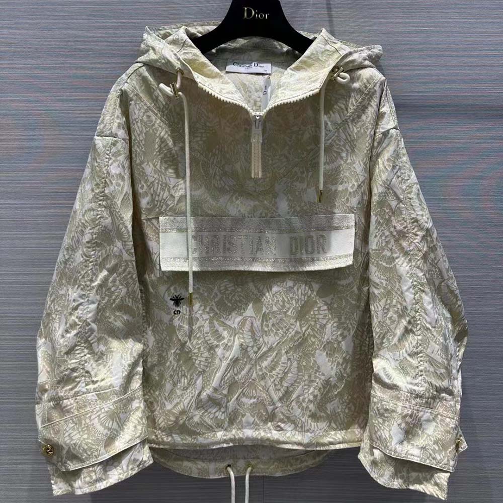 Close-up of gold-tone zipper and jacquard texture on Dior windbreaker