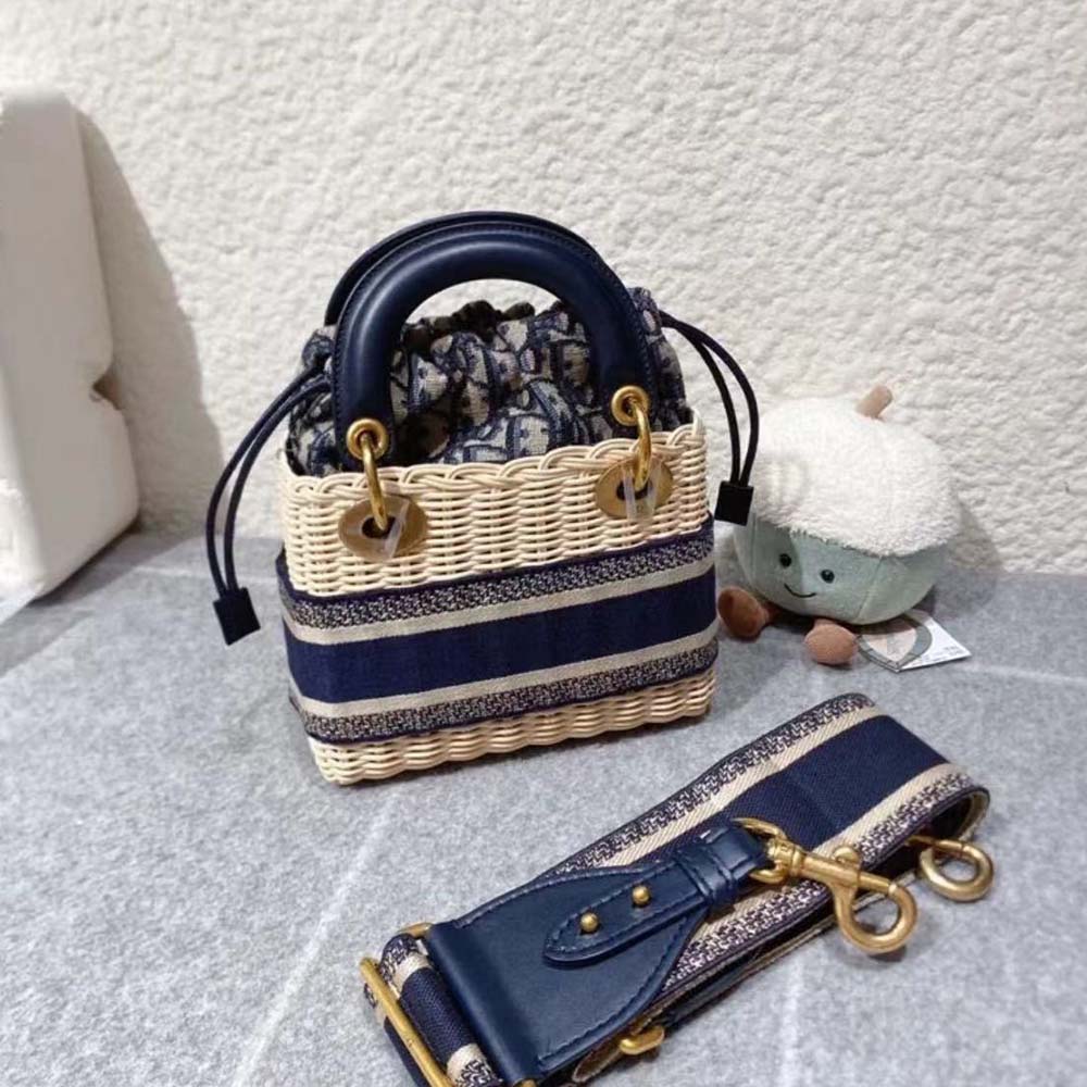 Side angle showing wicker texture and blue Dior Oblique jacquard details
