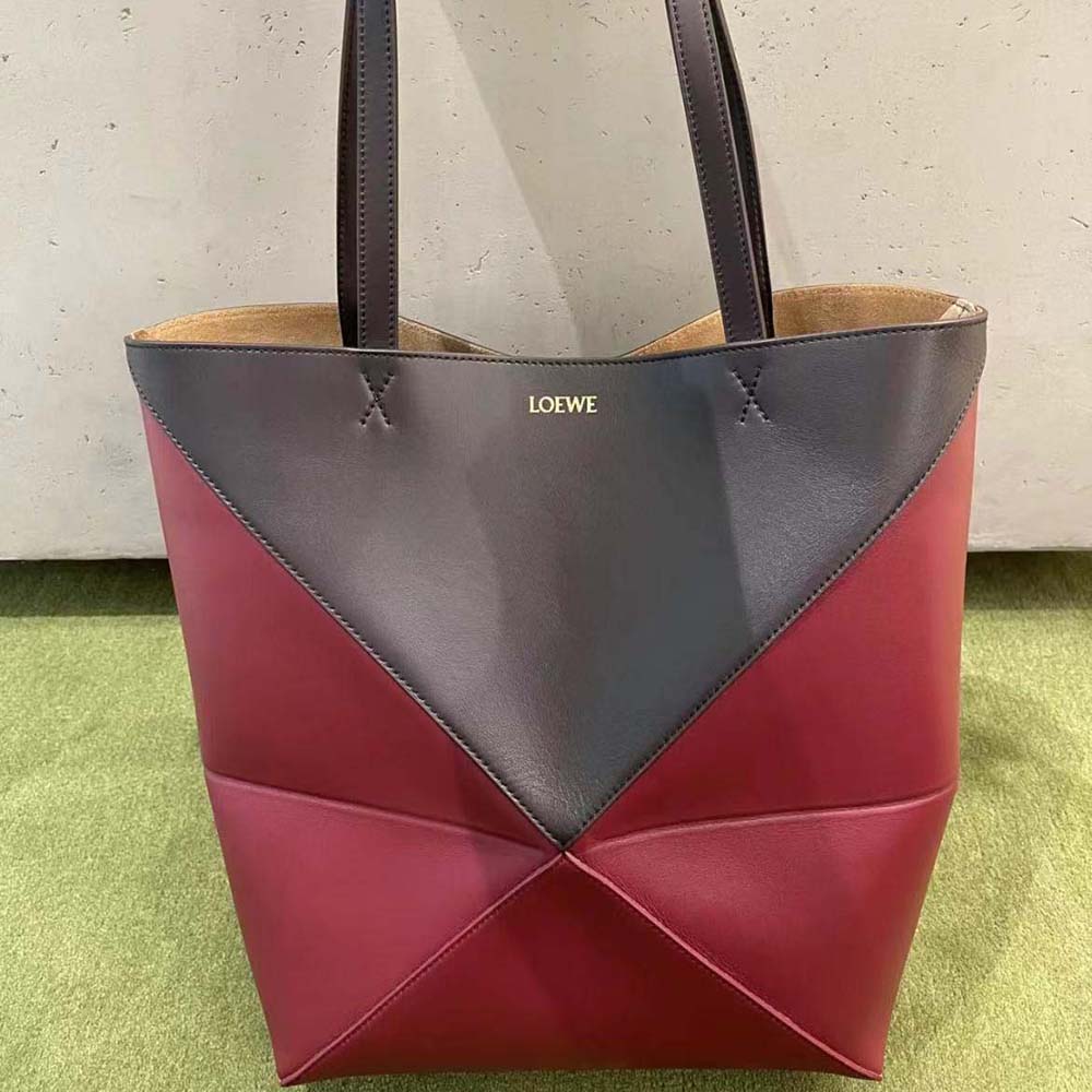 Side profile of Loewe Unisex Puzzle Fold Tote showing fold closure