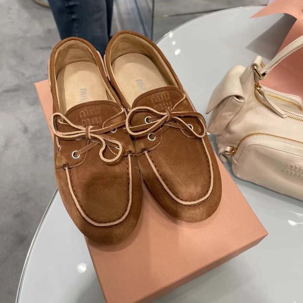 Close-up of bleached brown leather texture on Miu Miu Women Loafers