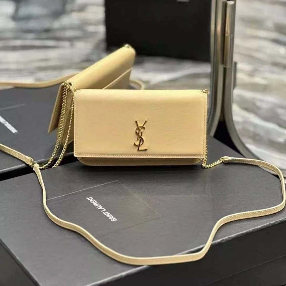 Close-up of gold YSL logo hardware on Cassandre Phone Holder