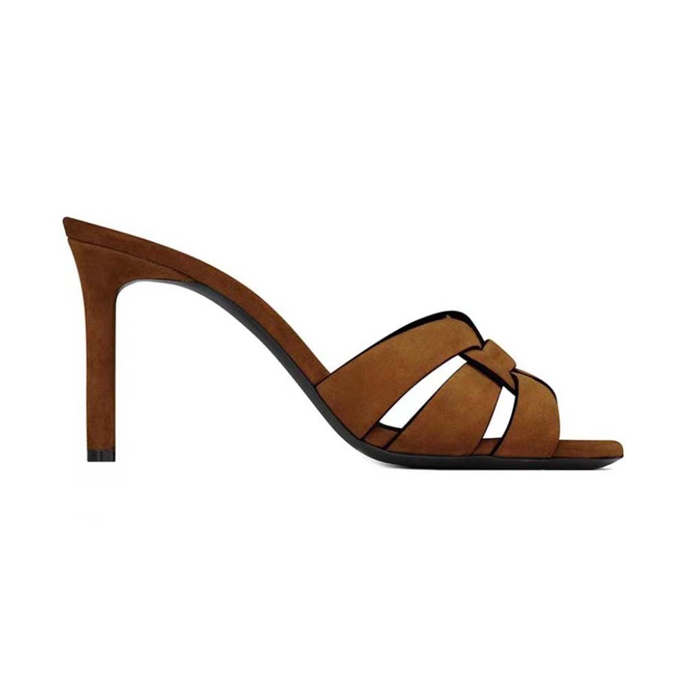 Close-up of gold YSL logo hardware on Saint Laurent Tribute Mules