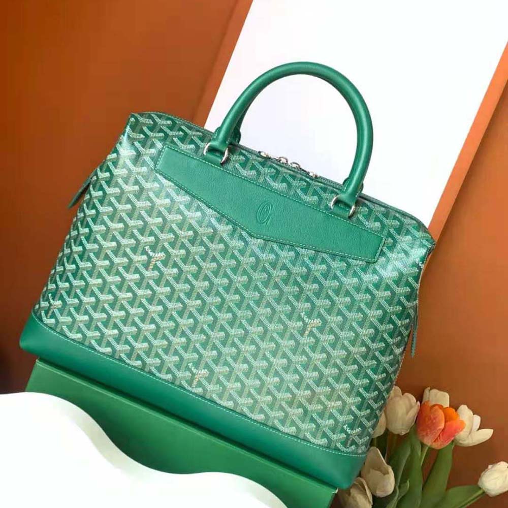 Close-up of green Goyard Cisalpin Document Case with brass hardware detail
