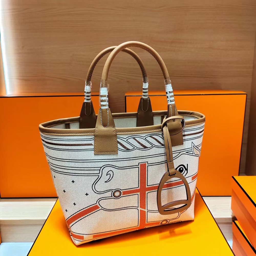 Close-up of gold-tone hardware on Hermes Unisex Steeple 25 Tote Bag