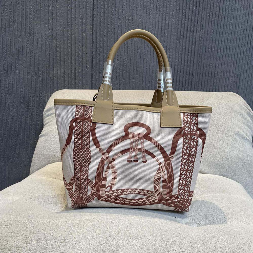Side angle showing silhouette of Hermes Unisex Steeple 25 Ecru Tote Bag-Brown