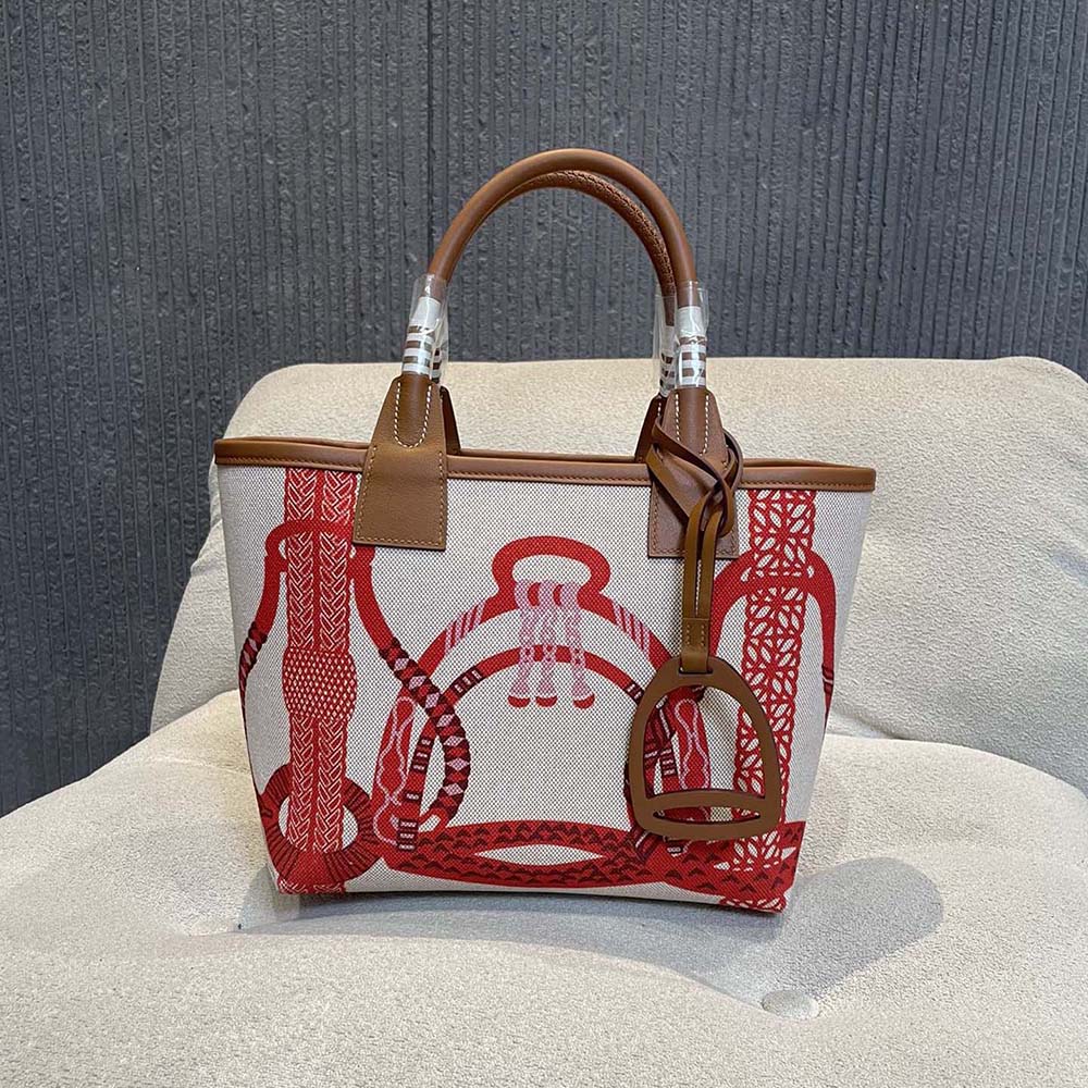 Close-up of silver-tone hardware on Hermes Unisex Steeple 25 Tote Bag-Orange
