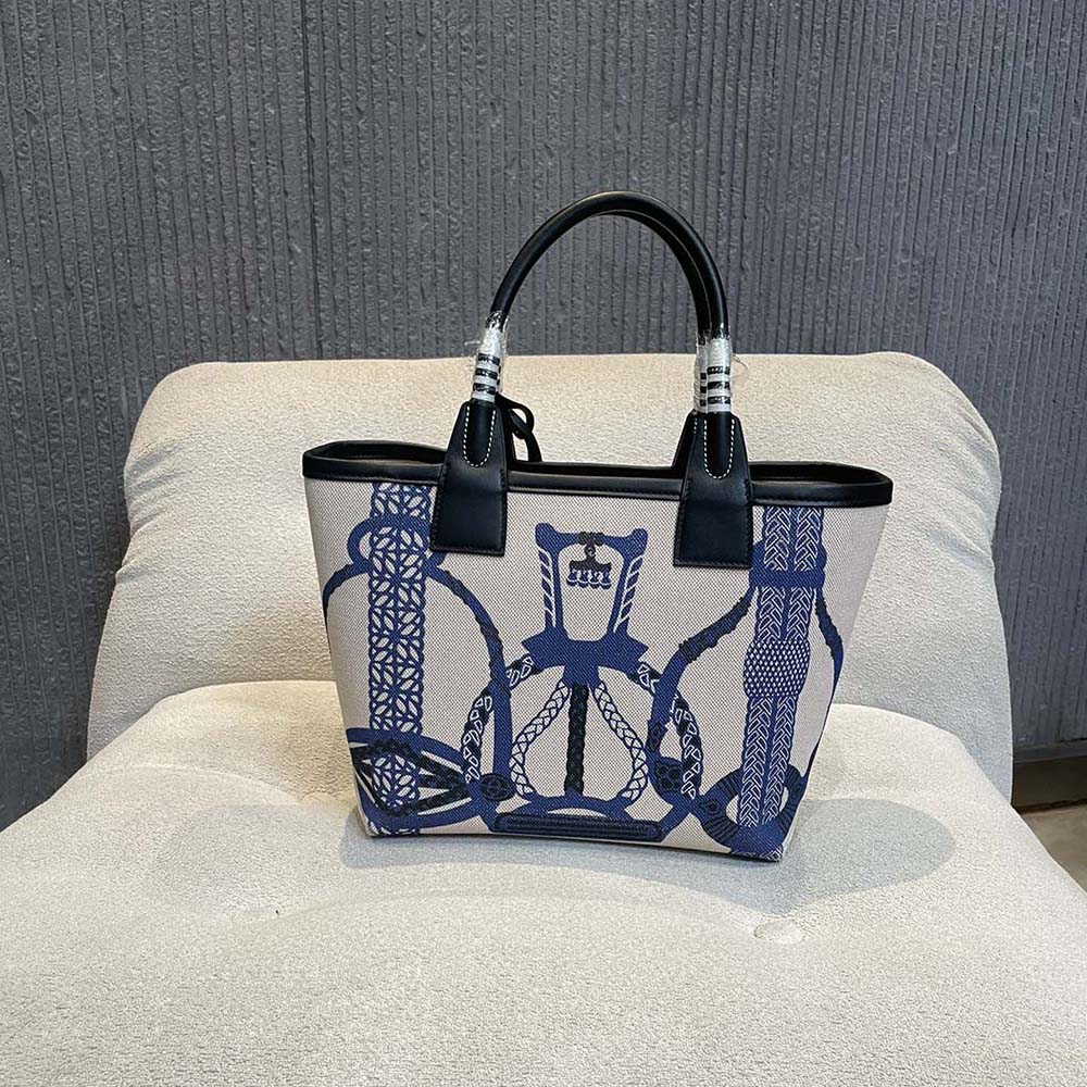 Side profile showing leather texture of Hermes Unisex Steeple 25 Ecru Tote Bag-Blue