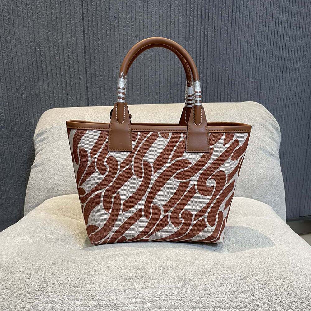 Side angle showing spacious interior of Hermes Unisex Steeple 28 Tote Bag