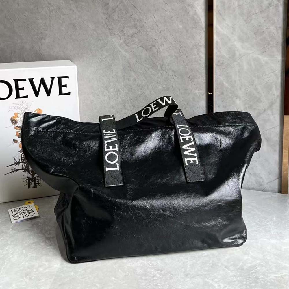 Side angle showing fold-over silhouette of Loewe Unisex Fold Shopper