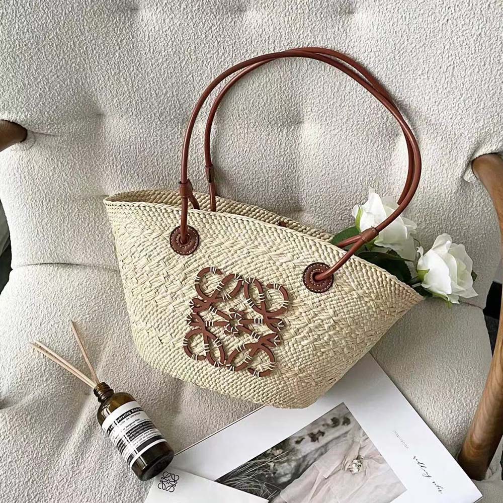 Close-up detail of embossed Anagram hardware on Loewe Small Anagram Basket Bag