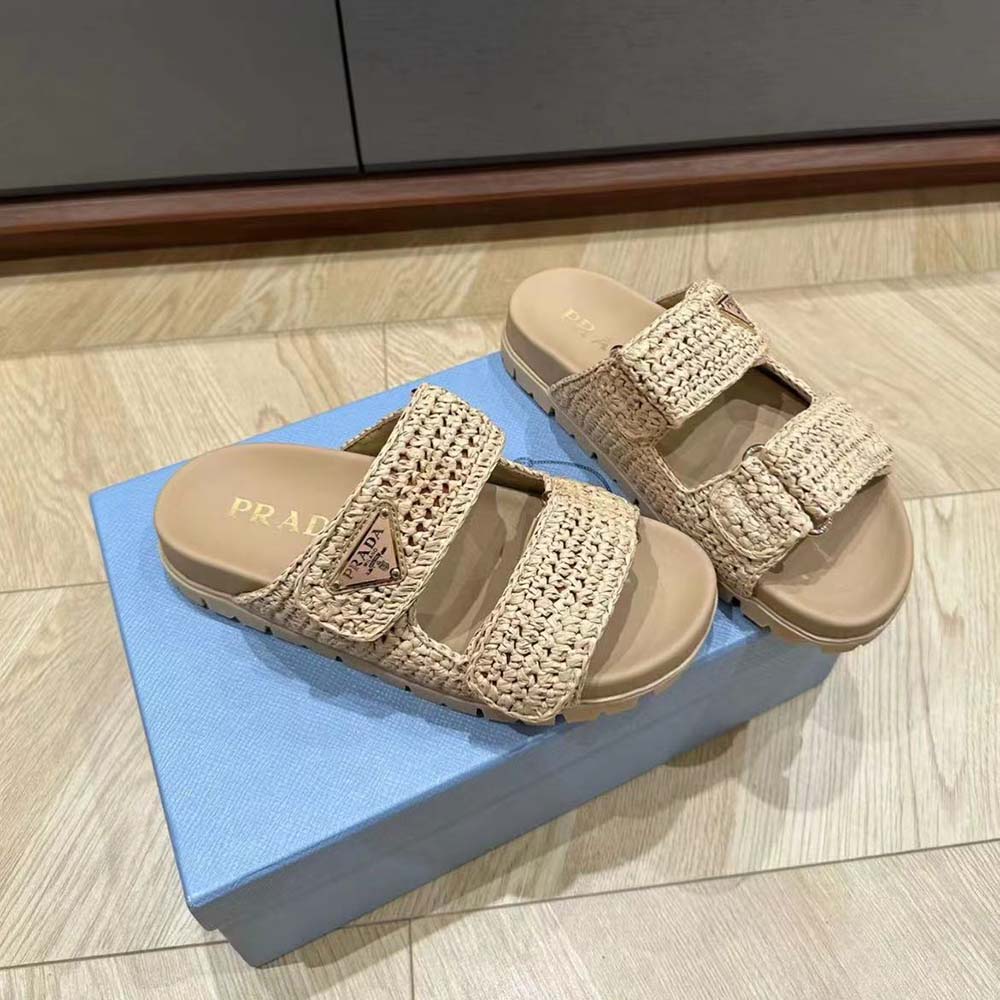 Close-up of beige crochet upper and Prada embossed logo on sandal