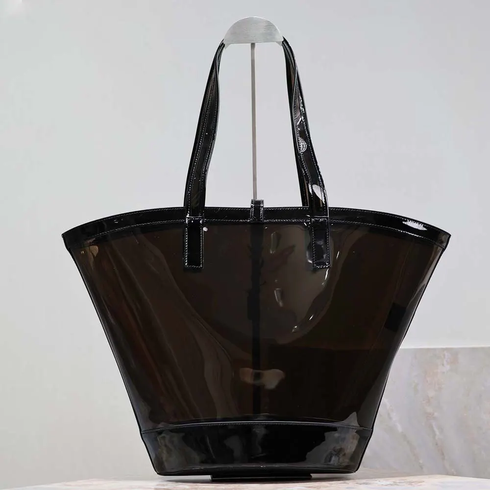 Side angle showing magnetic closure and glossy leather trim on Saint Laurent Panier