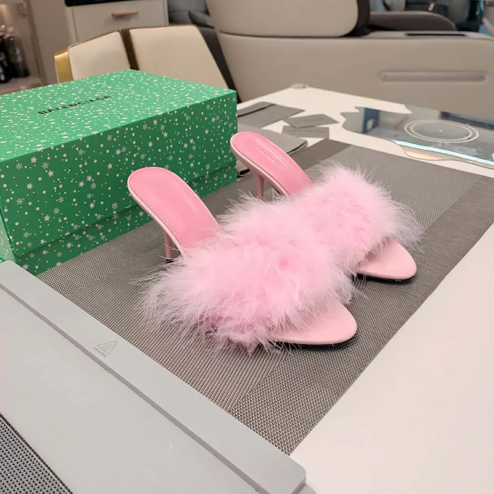 Rear view showing 70mm heel and buckle of Balenciaga pink feather sandal
