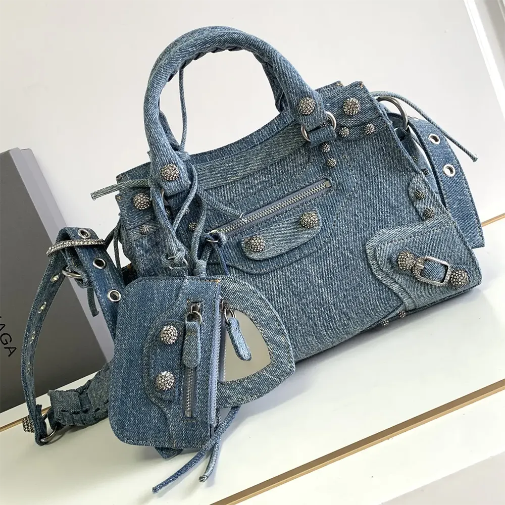 Close-up of rhinestone studs on Balenciaga Women Neo Cagole City Handbag Denim