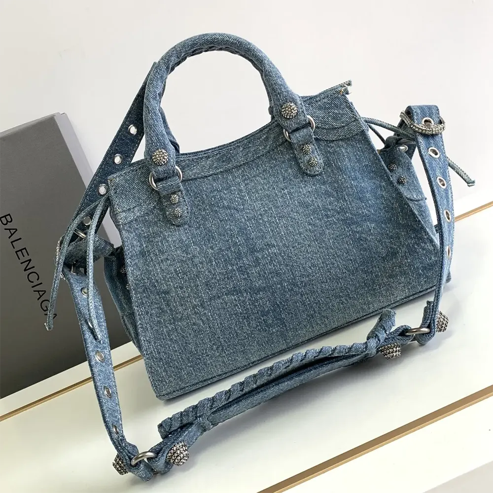 Side view showing adjustable strap of Balenciaga Women Neo Cagole City Handbag Denim