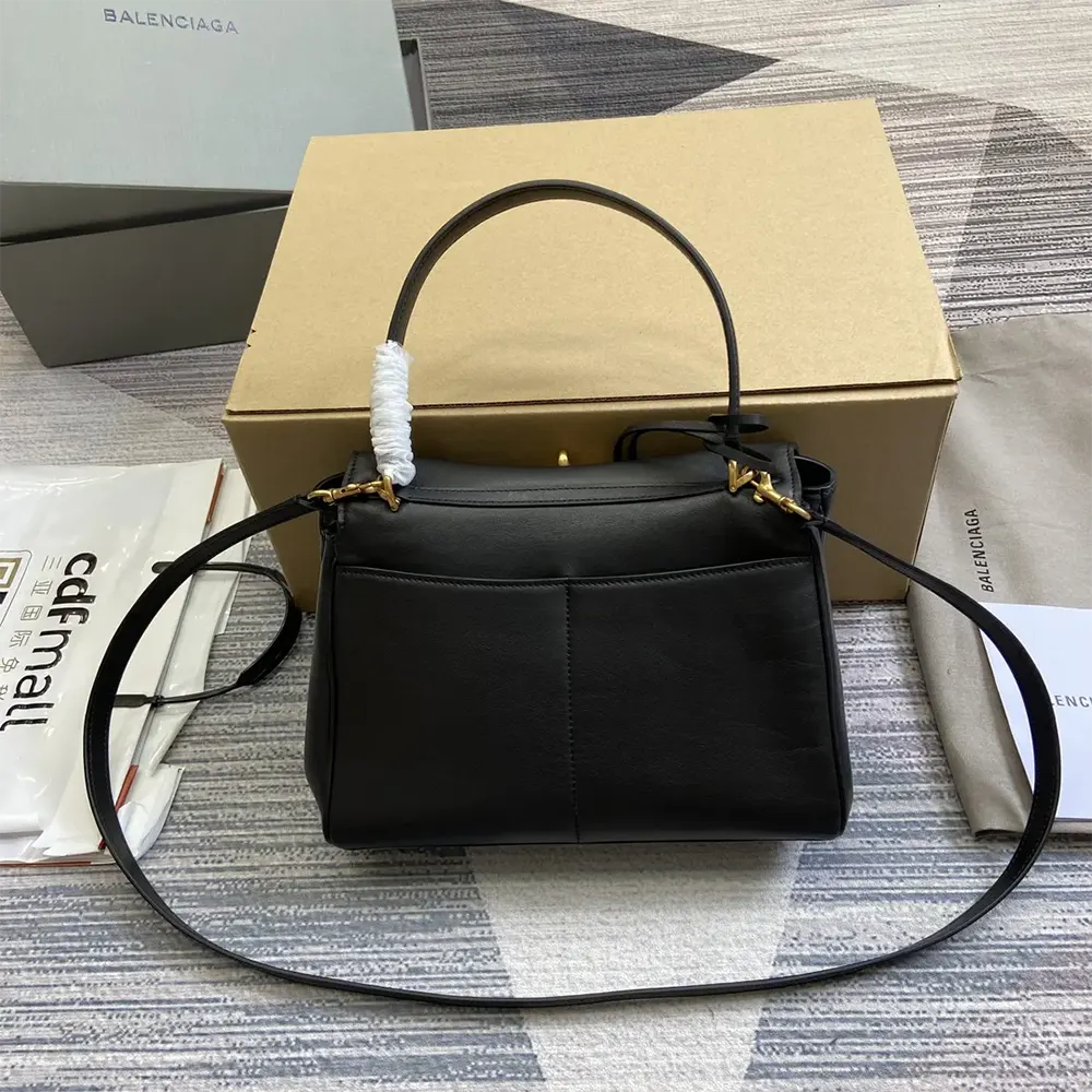 Side angle showing silhouette and zip closure of Balenciaga Rodeo Small handbag