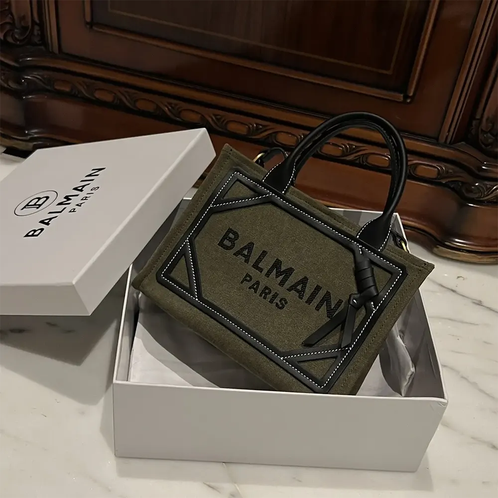 Close-up of leather inserts and gunmetal hardware on Balmain Women B-Army Bag