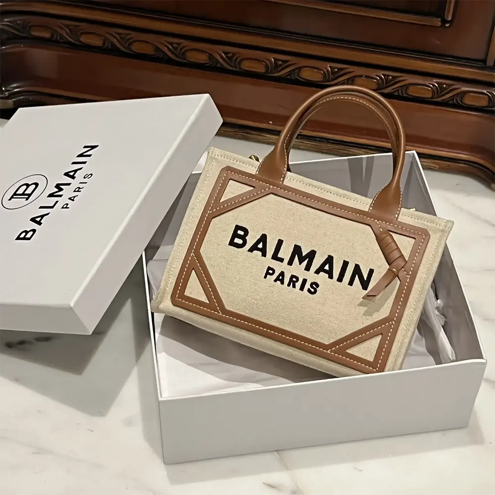 Close-up of beige canvas and leather details on Balmain Women B-Army bag