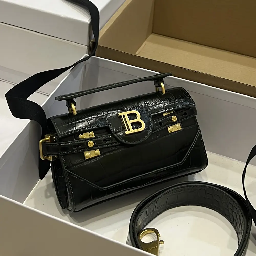 Close-up of gold-tone hardware and Balmain logo on B-Buzz 19 Bag
