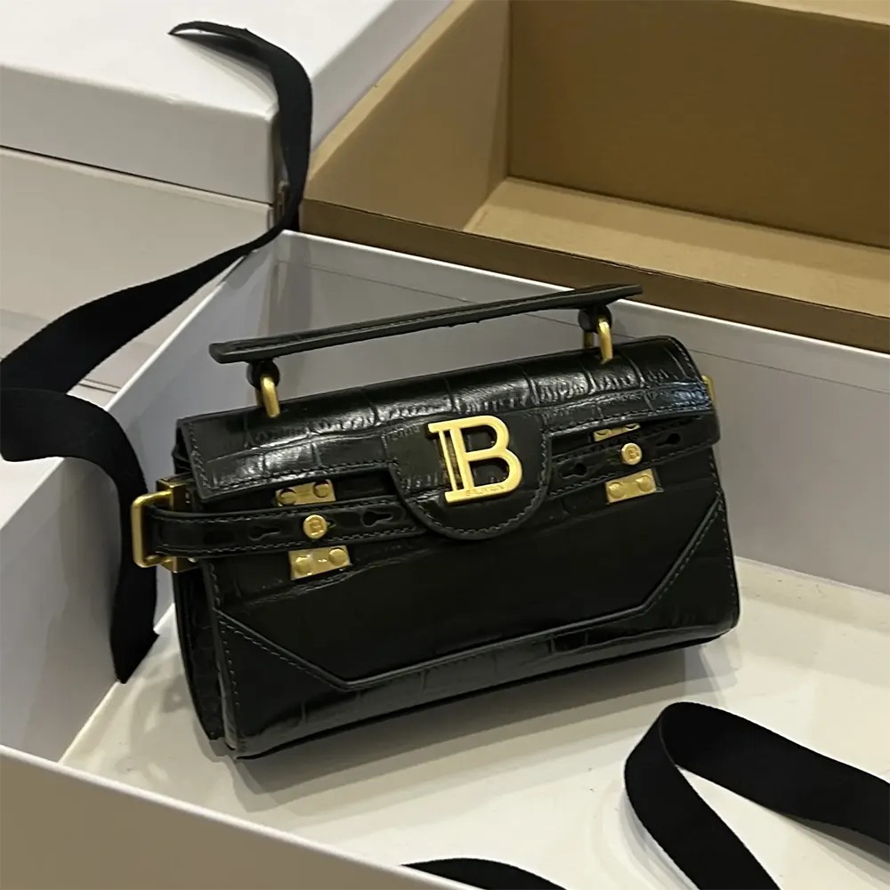 Side profile showing silhouette of Balmain Women B-Buzz 19 Bag black leather
