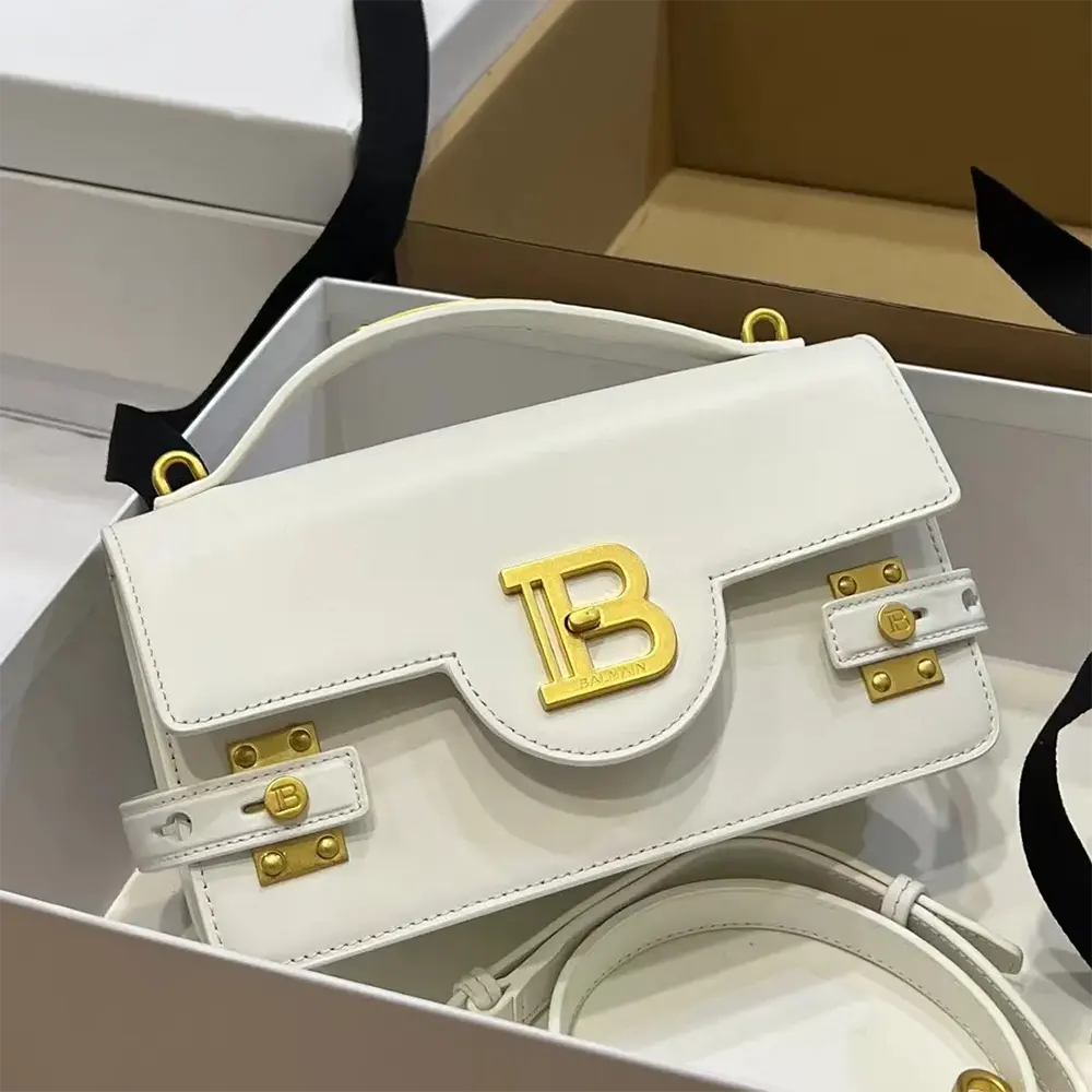 Close-up of gold hardware on Balmain Women B-Buzz Shoulder 24 Calfskin Bag-White