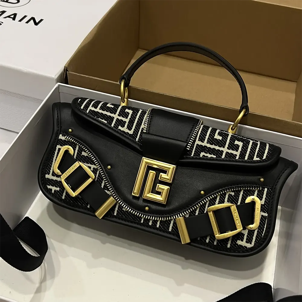 Side angle showing gold hardware of Balmain Women Blaze Clutch Bag