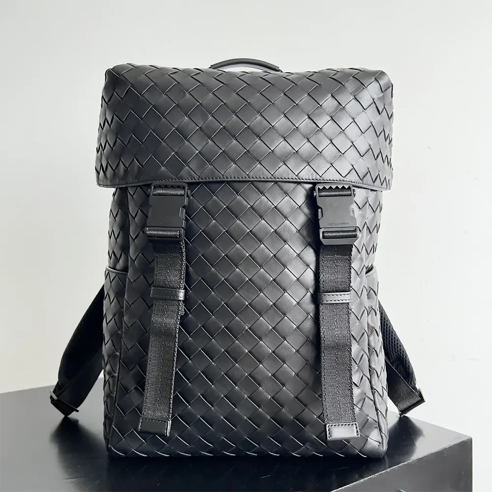 Close-up detail of intrecciato leather weave on black Bottega Veneta backpack