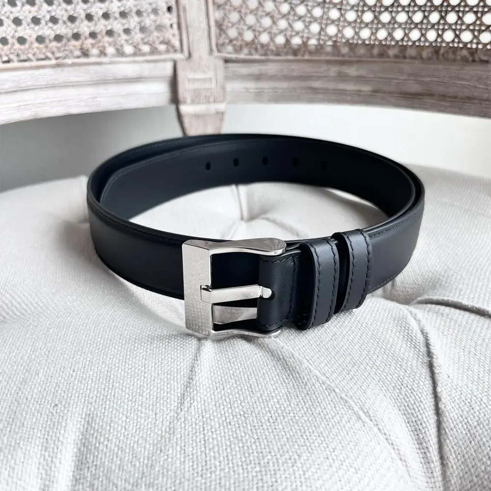 Close-up of tonal buckle detail on Bottega Veneta leather belt