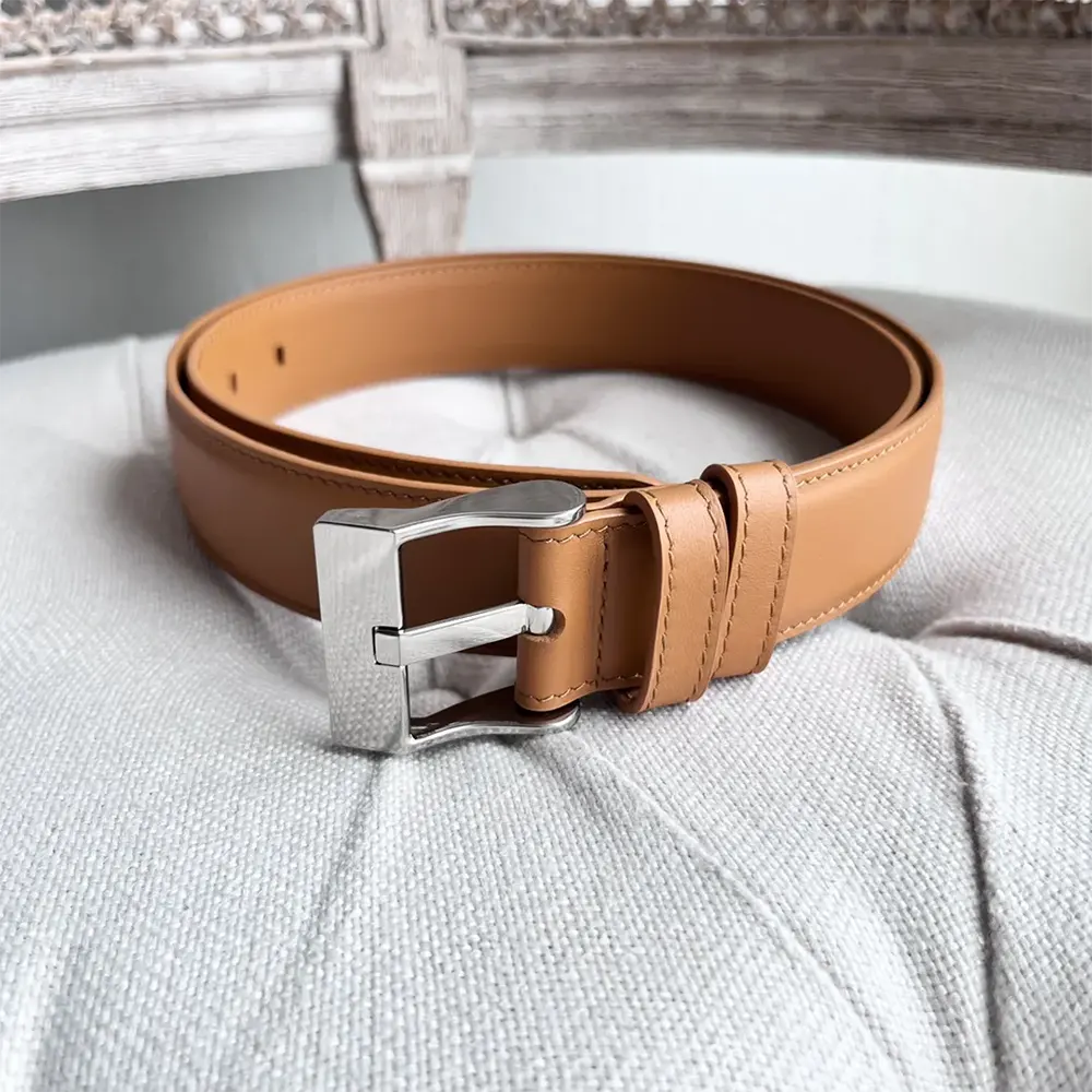 Close-up of wooden buckle detail on Bottega Veneta leather belt