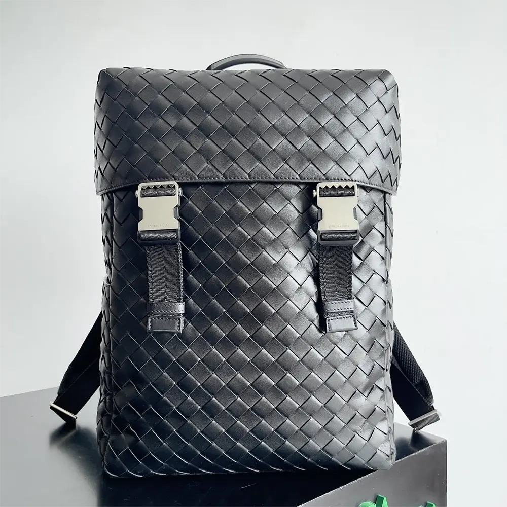 Close-up on black woven leather and gunmetal hardware detail