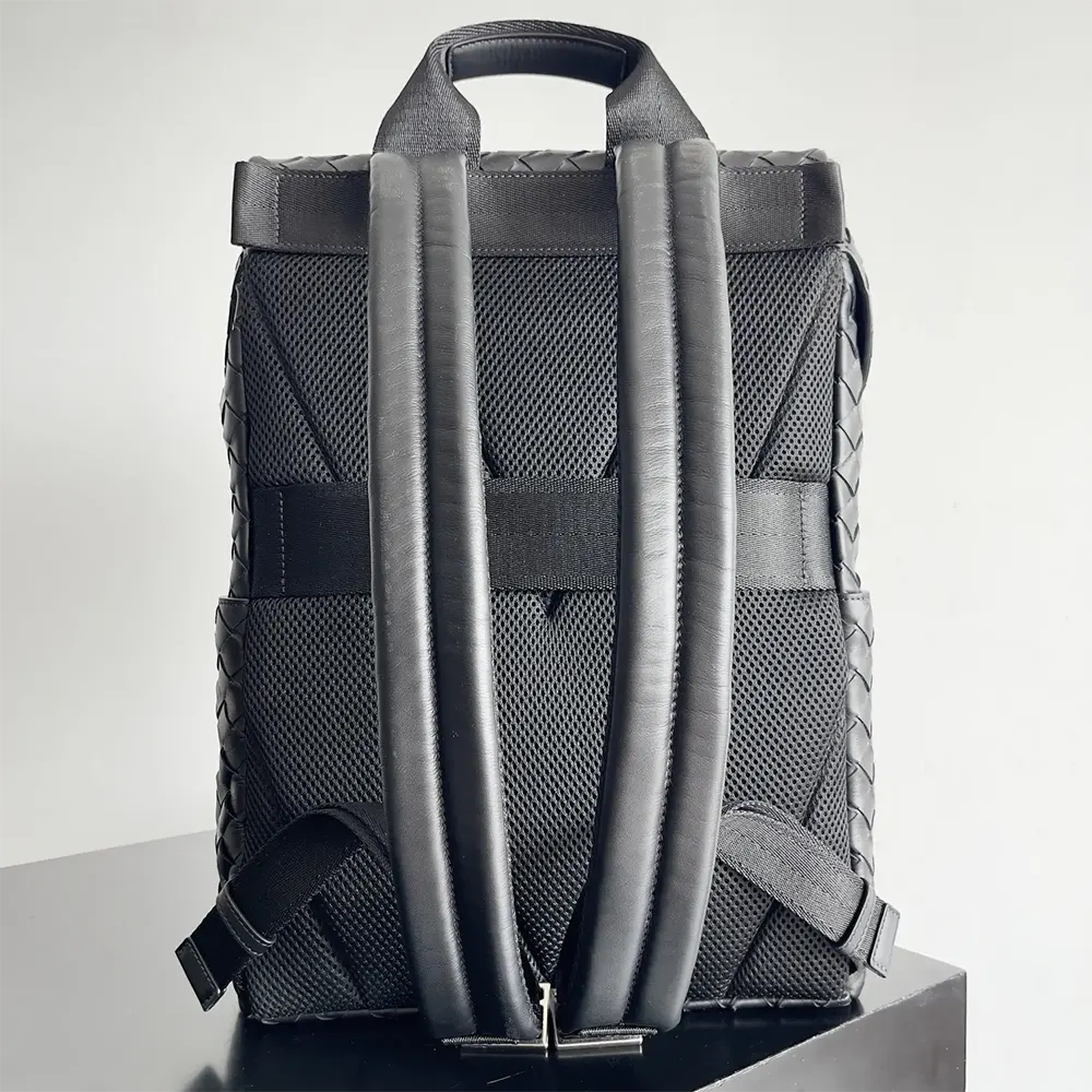 Side view showing compact shape of Bottega Veneta Intrecciato Backpack
