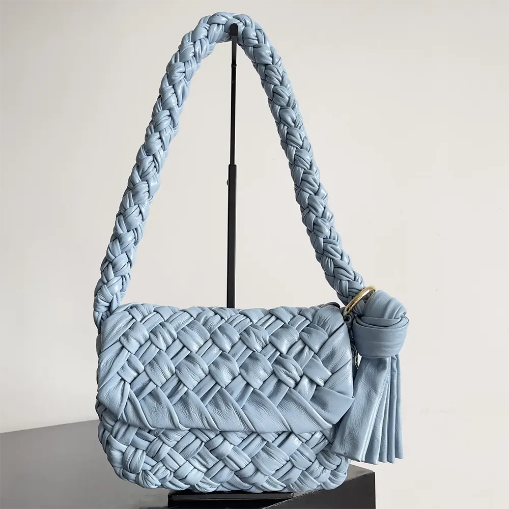 Close-up of intrecciato weave detail on Kalimero Città bag by Bottega Veneta