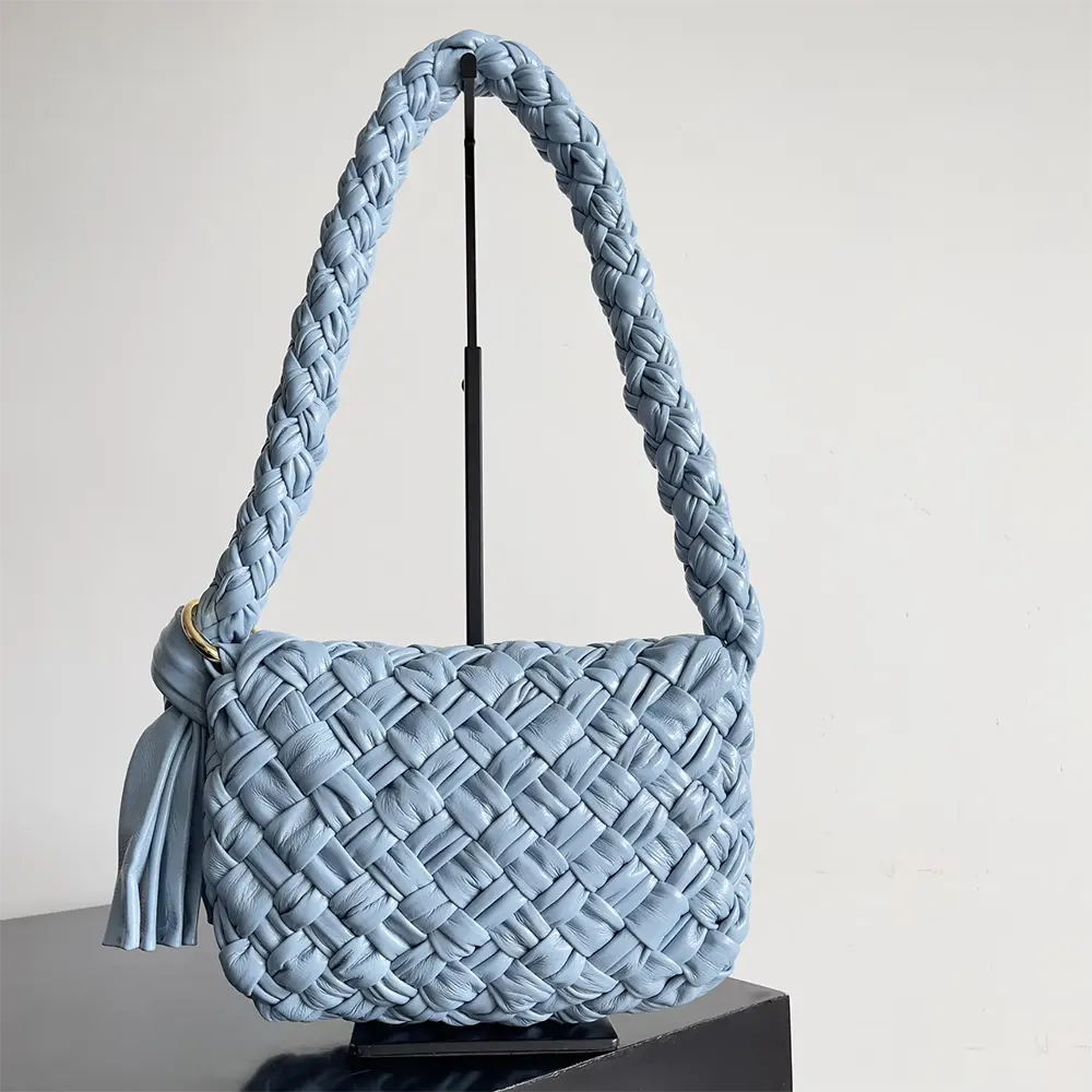 Side angle showing gold-tone hardware on Bottega Veneta Women Kalimero Città