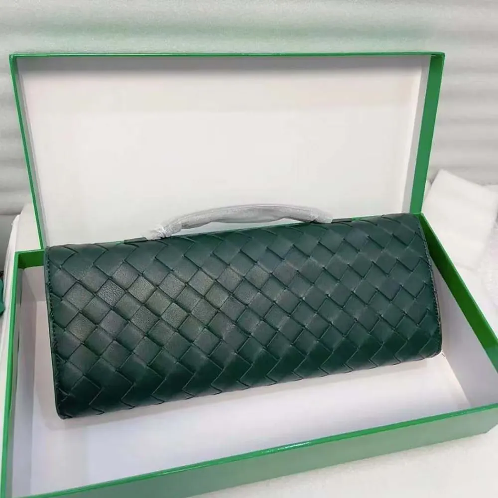 Side angle showing gold-tone hardware on Bottega Veneta clutch