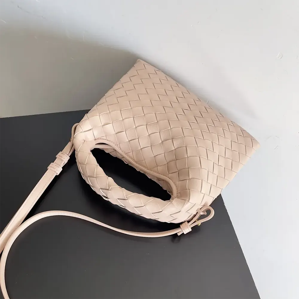 Side profile showcasing adjustable shoulder strap on Bottega Veneta Mini Hop pink